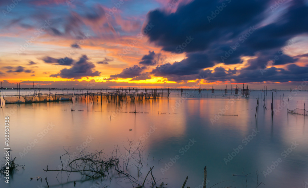 fishing moored at sea. Clouds and light evening twilight.