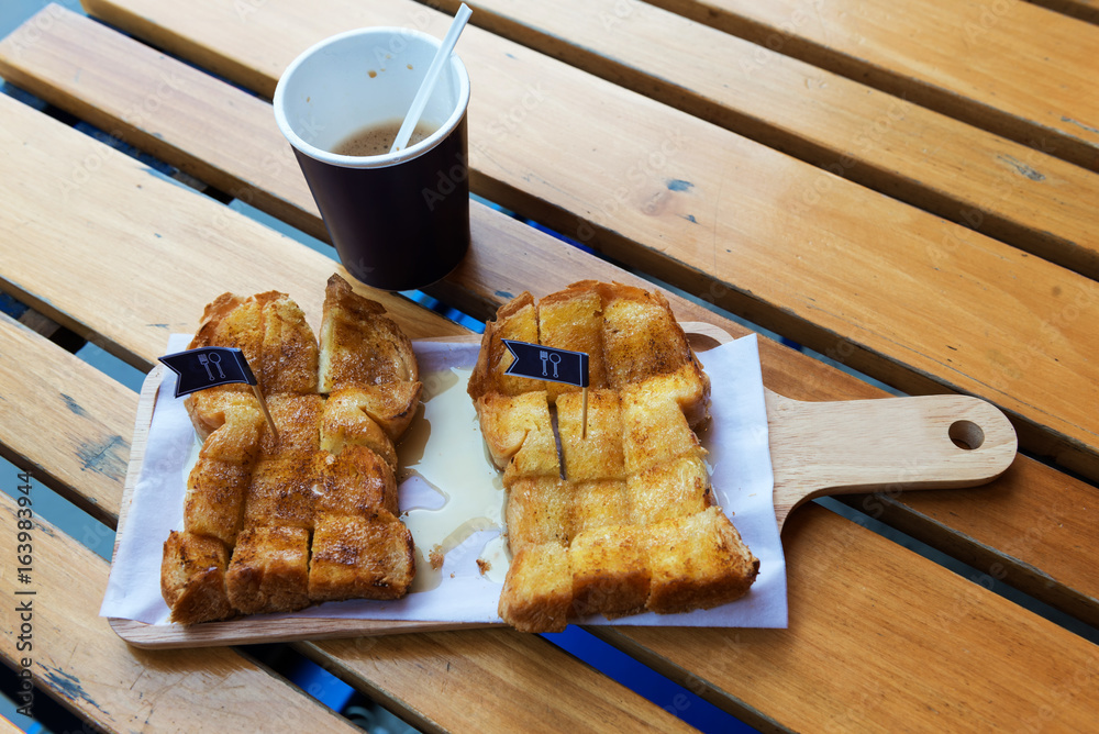 Soft focus toast and coffee for breakfast, lunch.