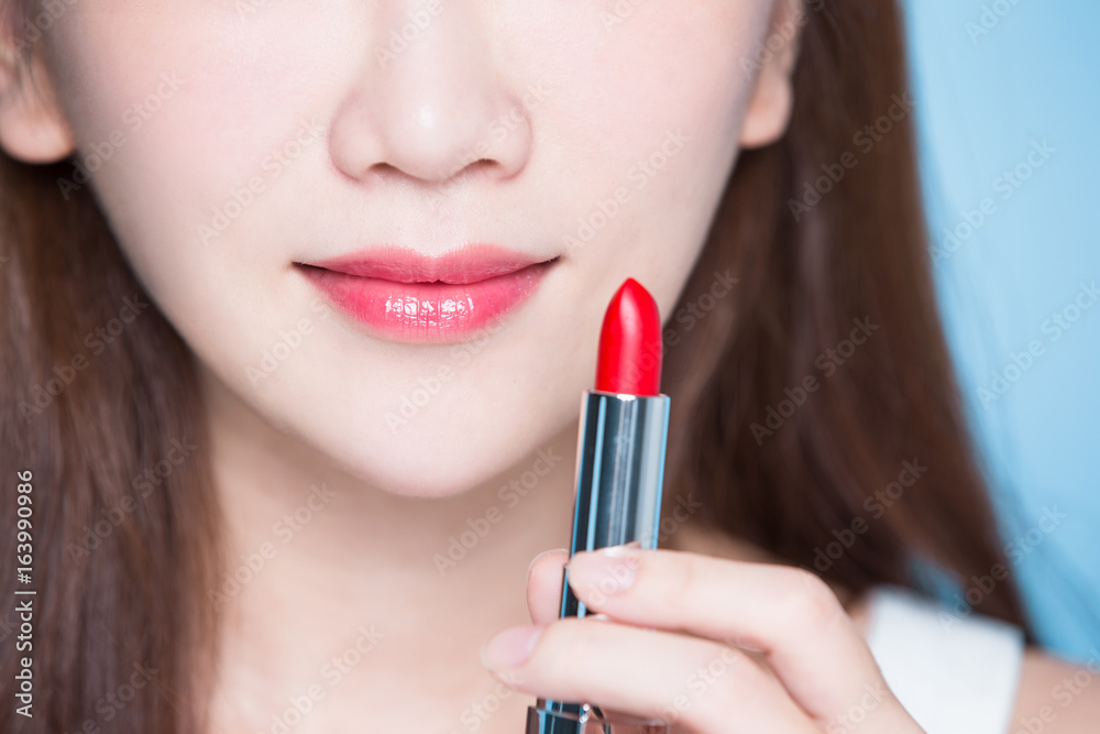 beauty woman take lipstick