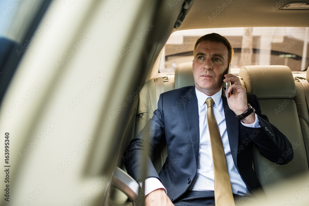 Businessman Talking Using Phone Car Inside