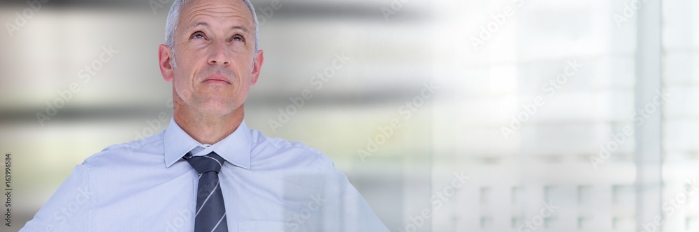 Thinking businessman with windows bright transition