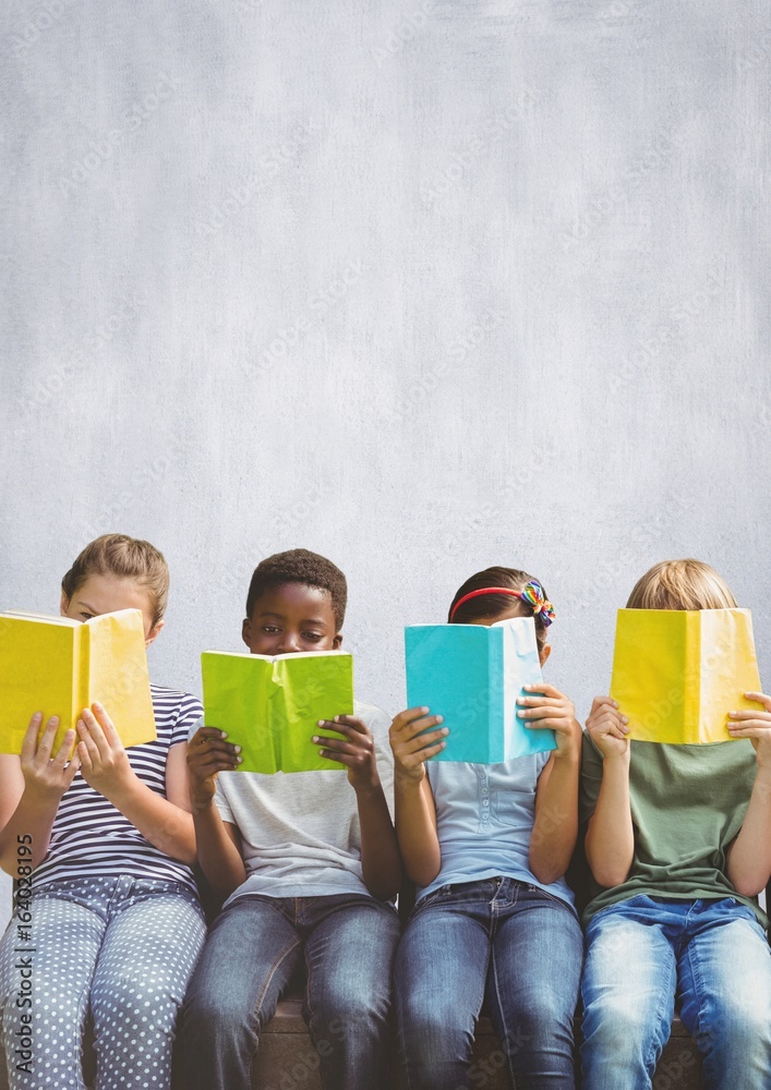 Group of children reading books in front of bright background