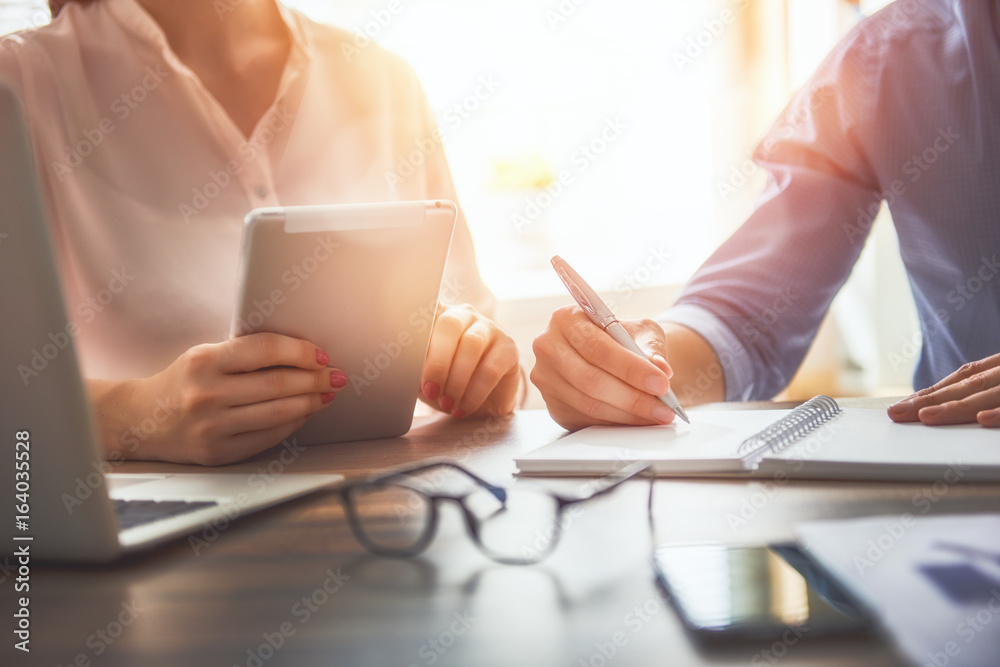 man and woman working in the office