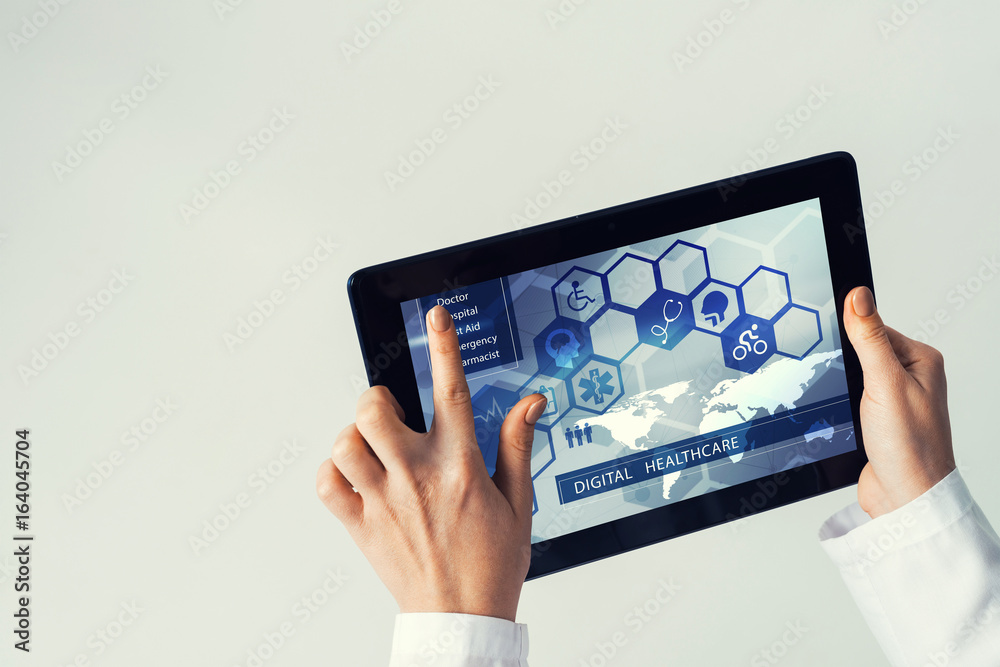 Close of female doctor hands working with tablet pc computer