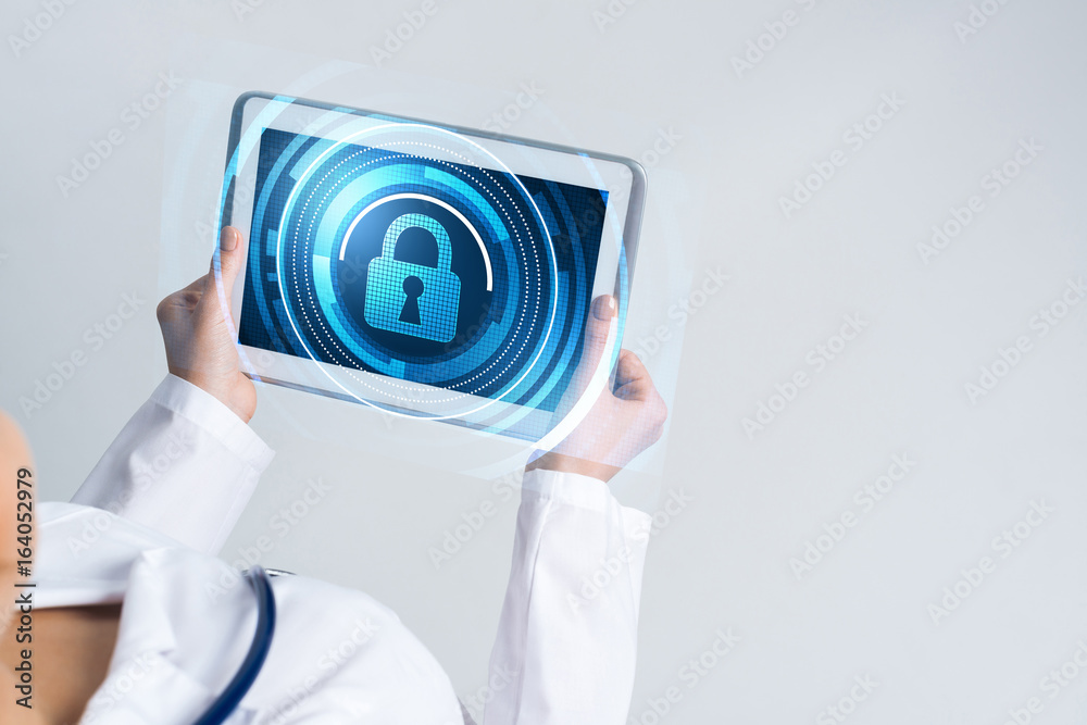 Close of female doctor hands working with tablet pc computer