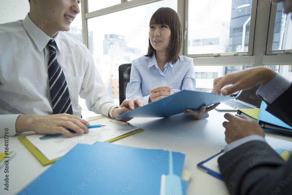 Businessmen are meeting while watching documents