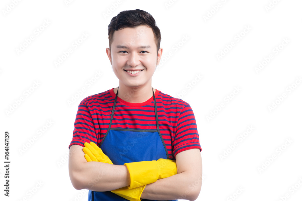 Handsome smiling asian man doing housework. Isolated over white.