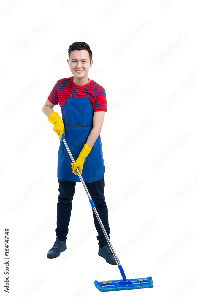 Handsome smiling asian man doing housework. Isolated over white.