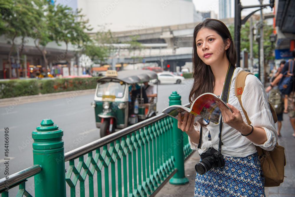 Tourist happy reading guide book