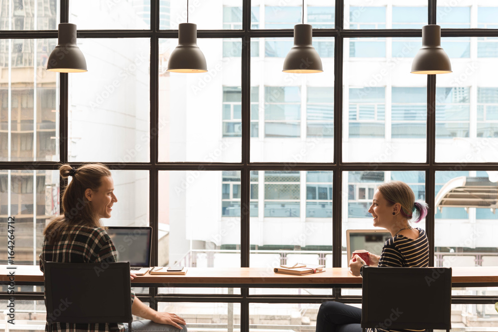 freelance working in coffee shop, Nomad worker conceptual, couple work together in cafe with laptop