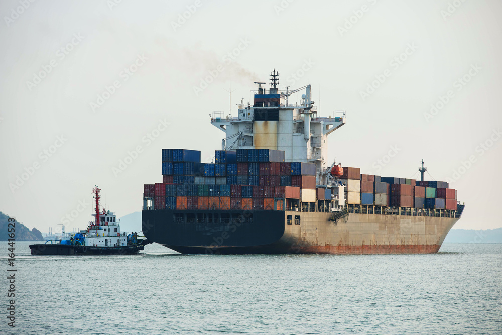 container ship in import export and business logistic.By crane ,Trade Port , Shipping,cargo to harbo