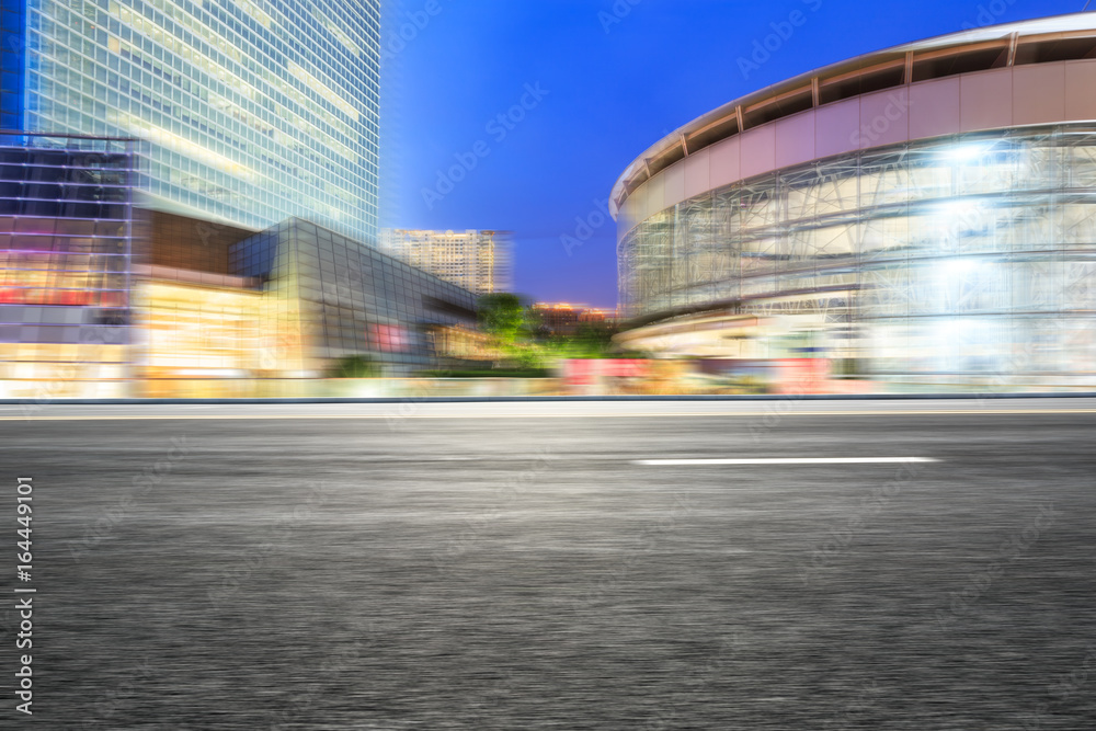 Motion blur asphalt road and modern buildings in Shanghai