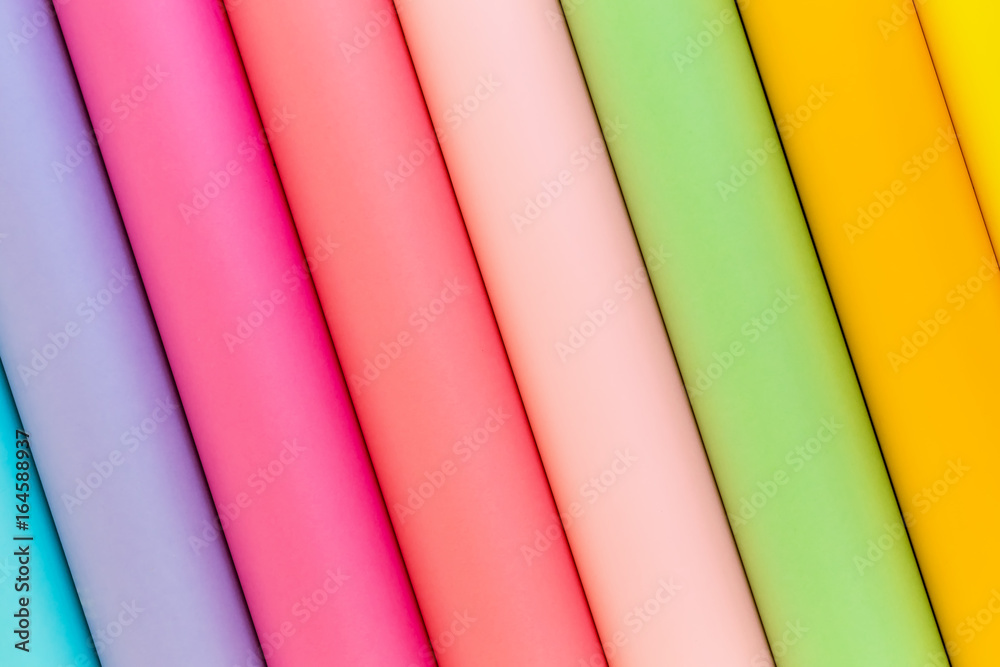 Colorful bright rolls of a paper arranged in a row