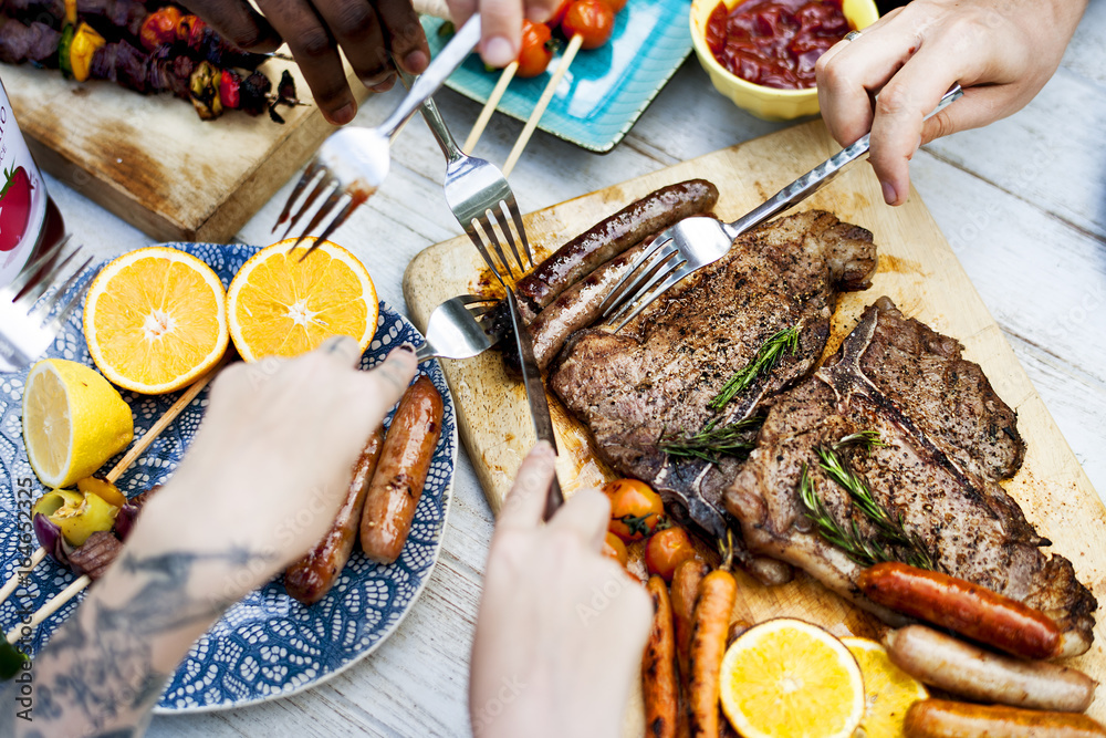 Closeup of homemade grilled food on wooden table summer party