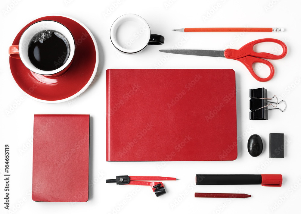 Closeup of red stationery on white table