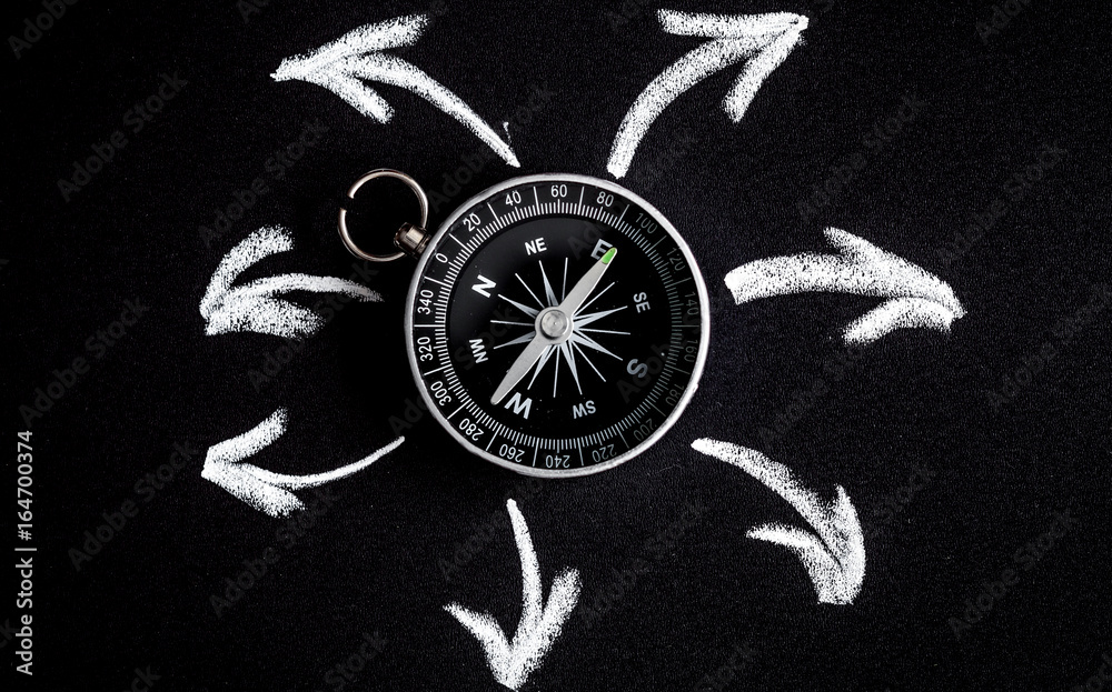 compass on dark background concept - arrows, direction top view