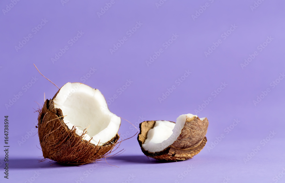 Fresh coconut on a bright purple background