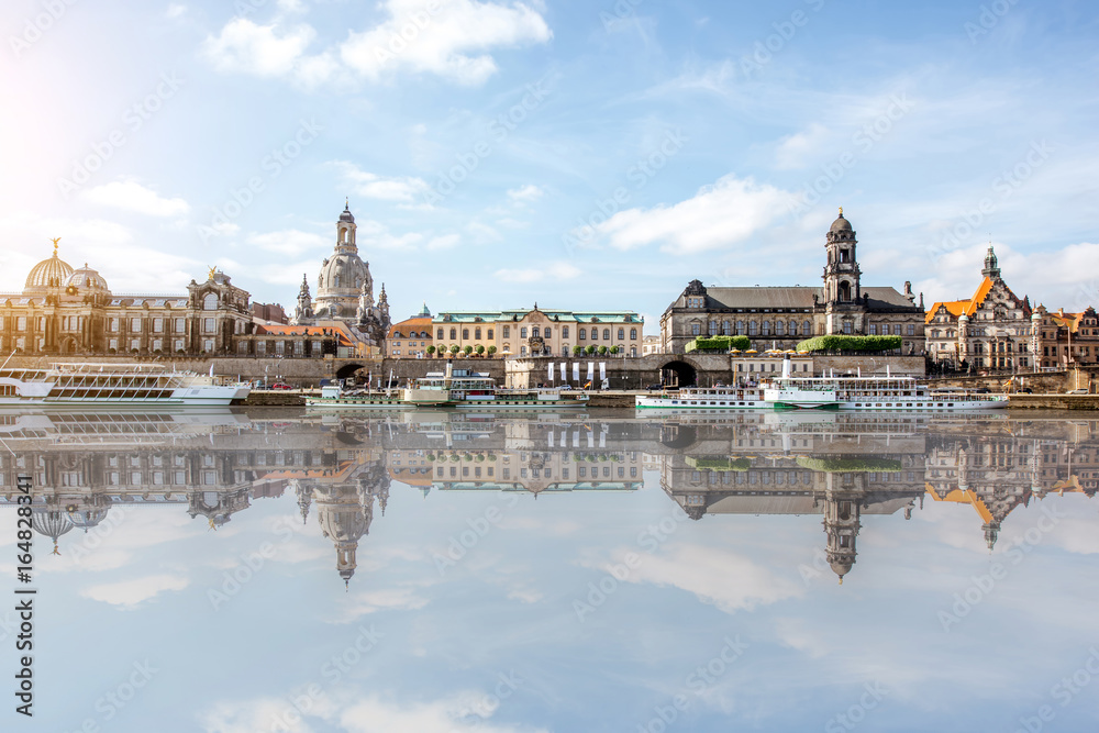 Panoramic view on the riverside of the old town with beautiful reflection on the water during the su