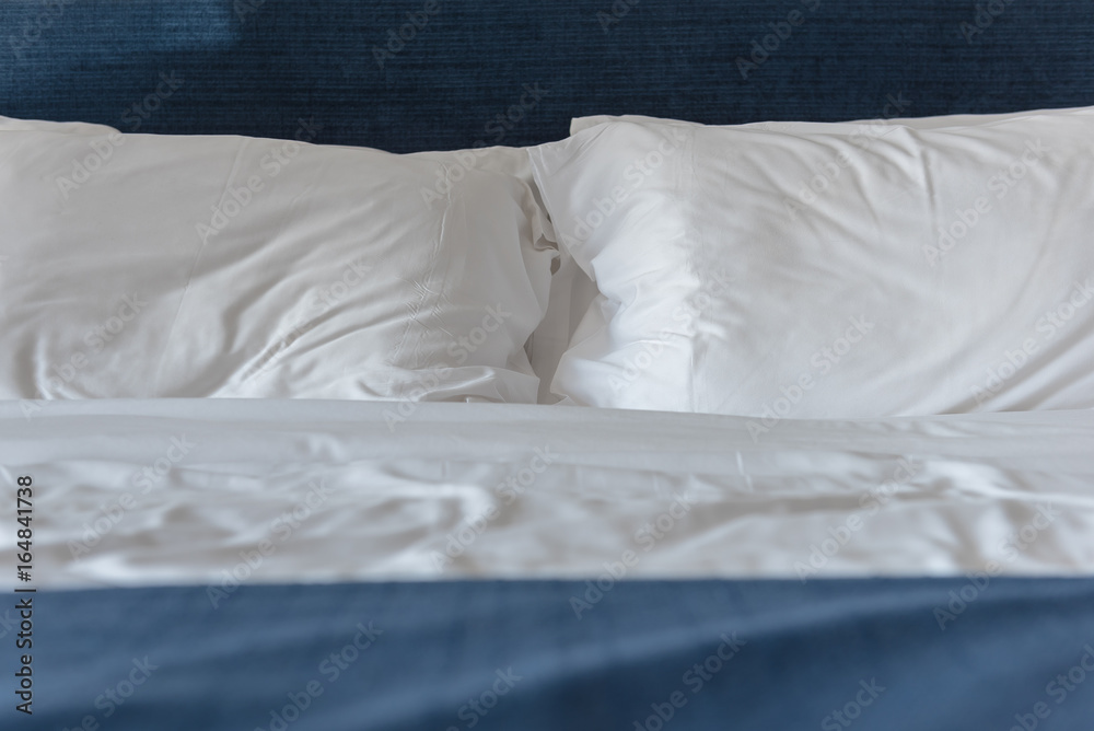 white pillows on bed