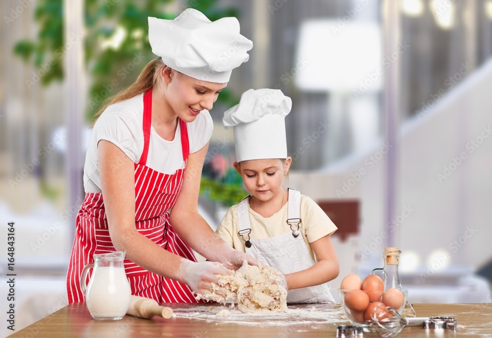 Mother and child cooking.