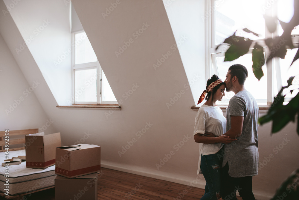 Loving couple moving into their new home