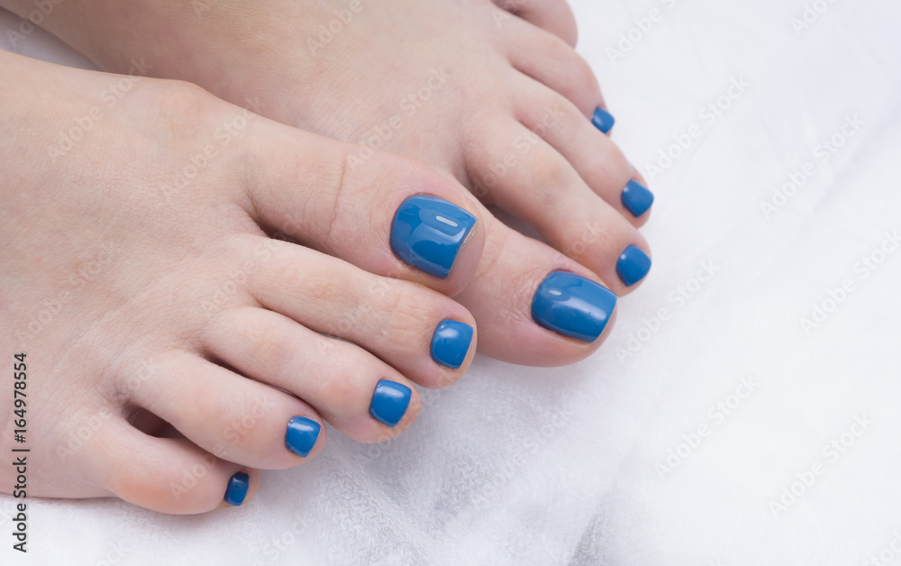 Womens foot and clean pedicure, natural nails. Gel polish applied.