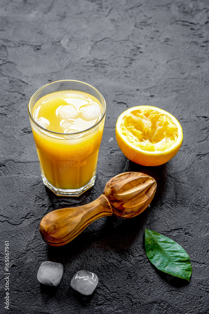 freshly squeezed orange juice on dark background