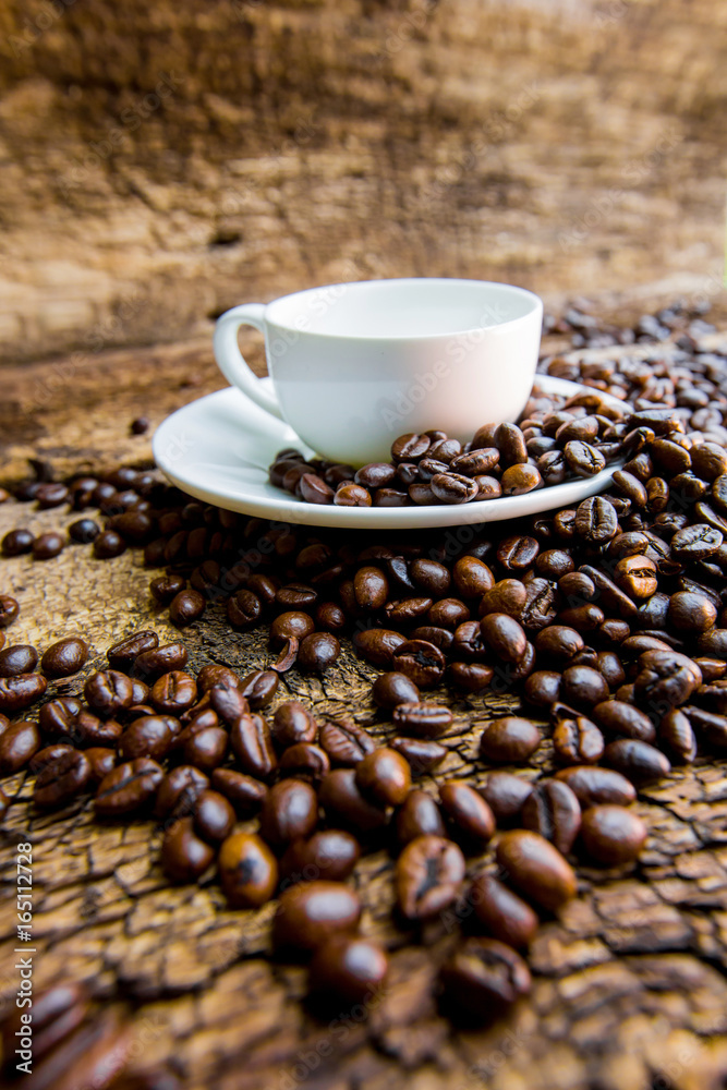 Coffee. Coffee beans. Coffee cup full of coffee beans.