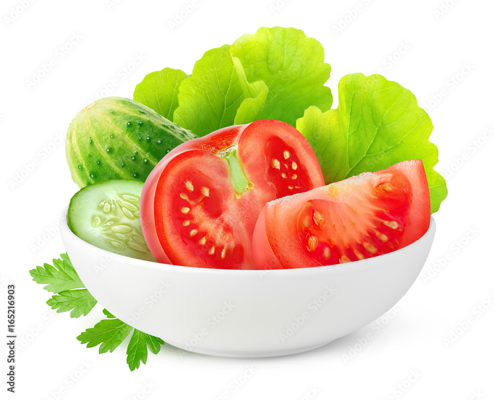 Isolated сut vegetables. Fresh cucumber, tomato and lettuce in ceramic bowl isolated on white backgr