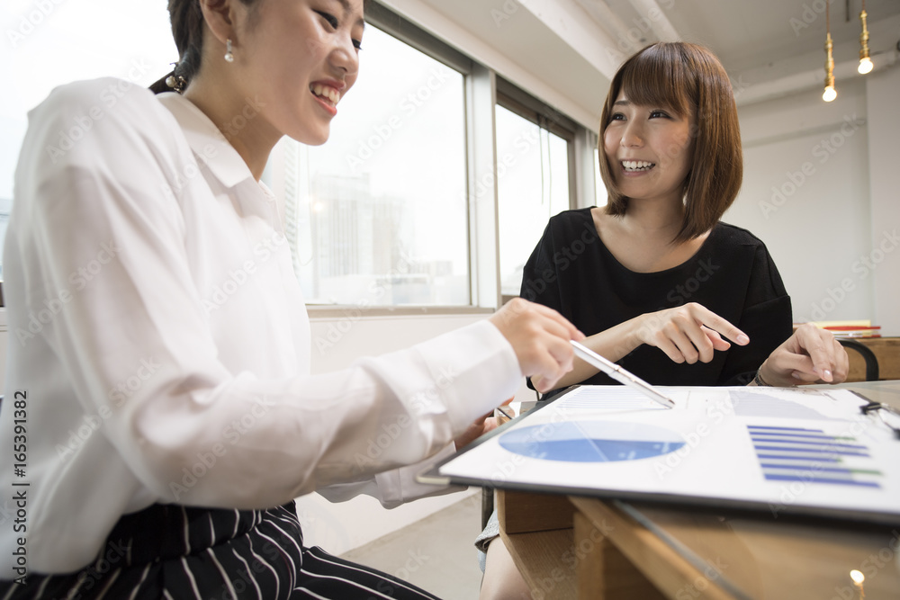 The two ladies are meeting at work at a cafe