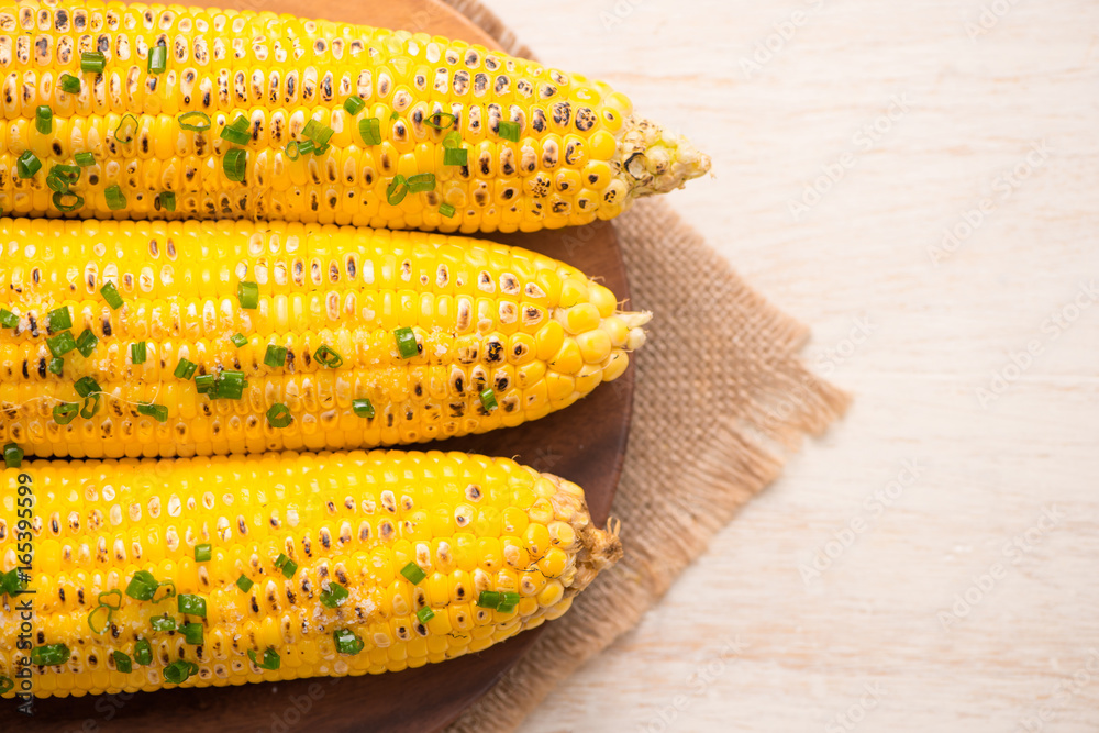 Tasty sweet grilled corn with onion sauce