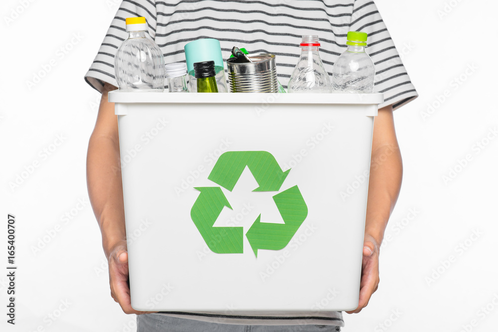 Eco concept. Male hands holding recycling bin full of recyclable items isolated on a white backgroun