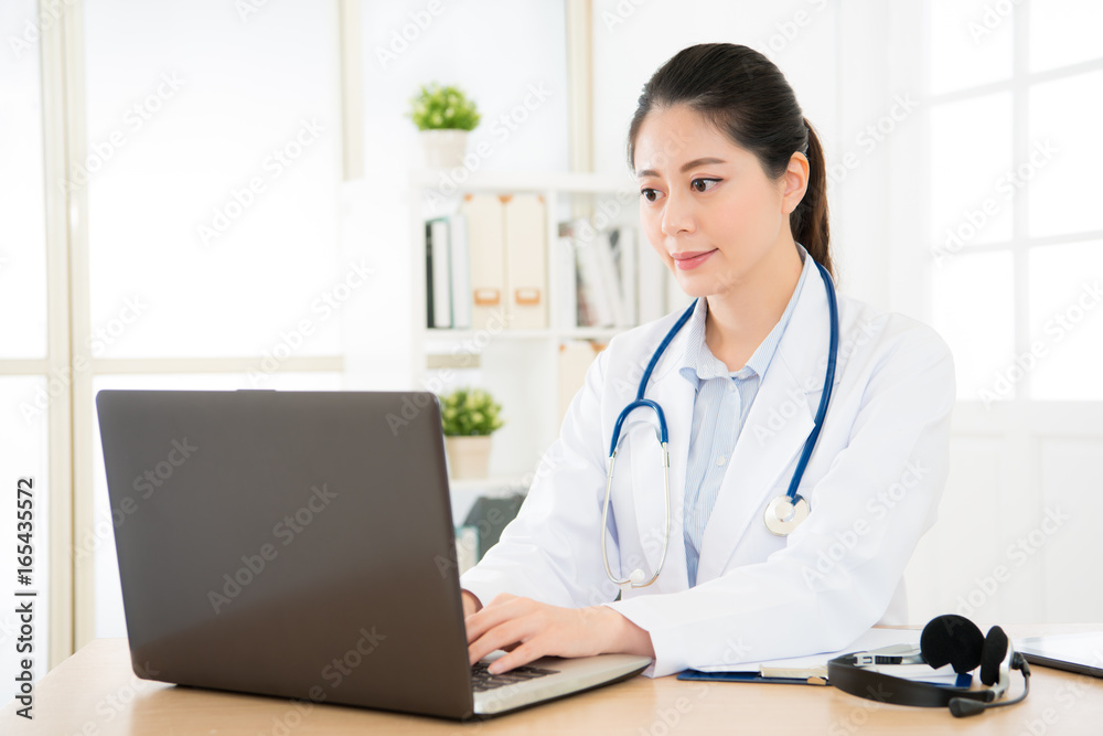 doctor working with her computer