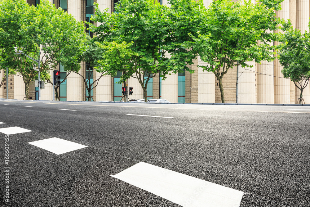 empty asphalt road and modern buildings in shanghai,china.