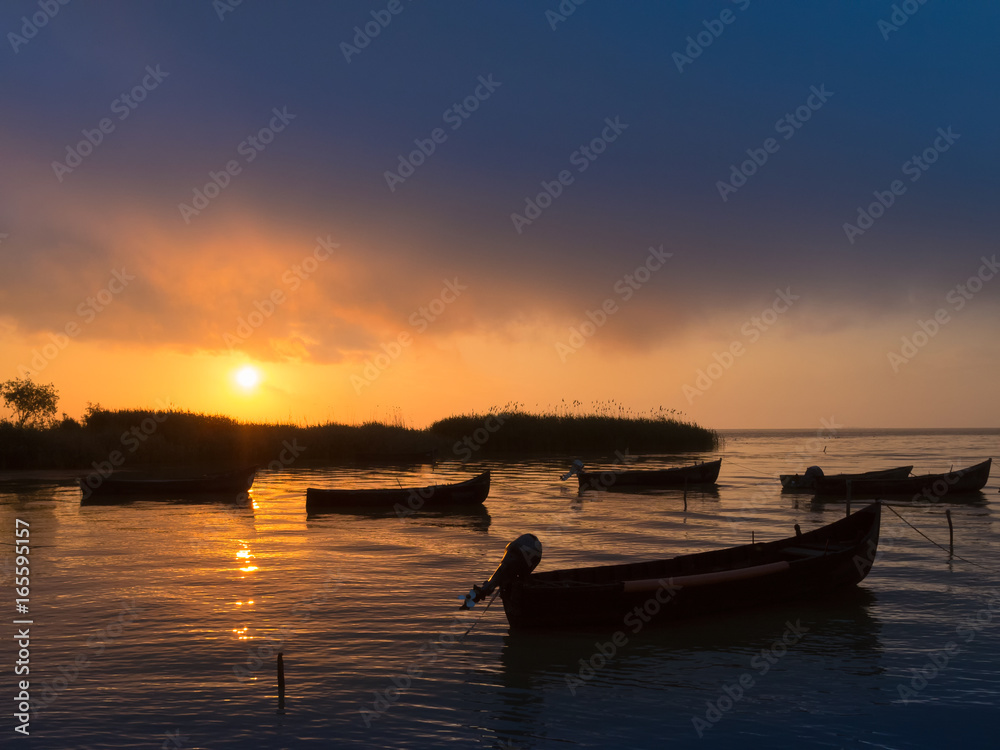 Amazing sunrise / sunset on lake. Sarichioi on Razelm lake. Romania