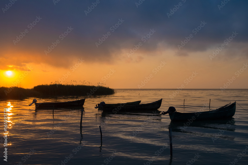 Amazing sunrise / sunset on lake. Sarichioi on Razelm lake. Romania