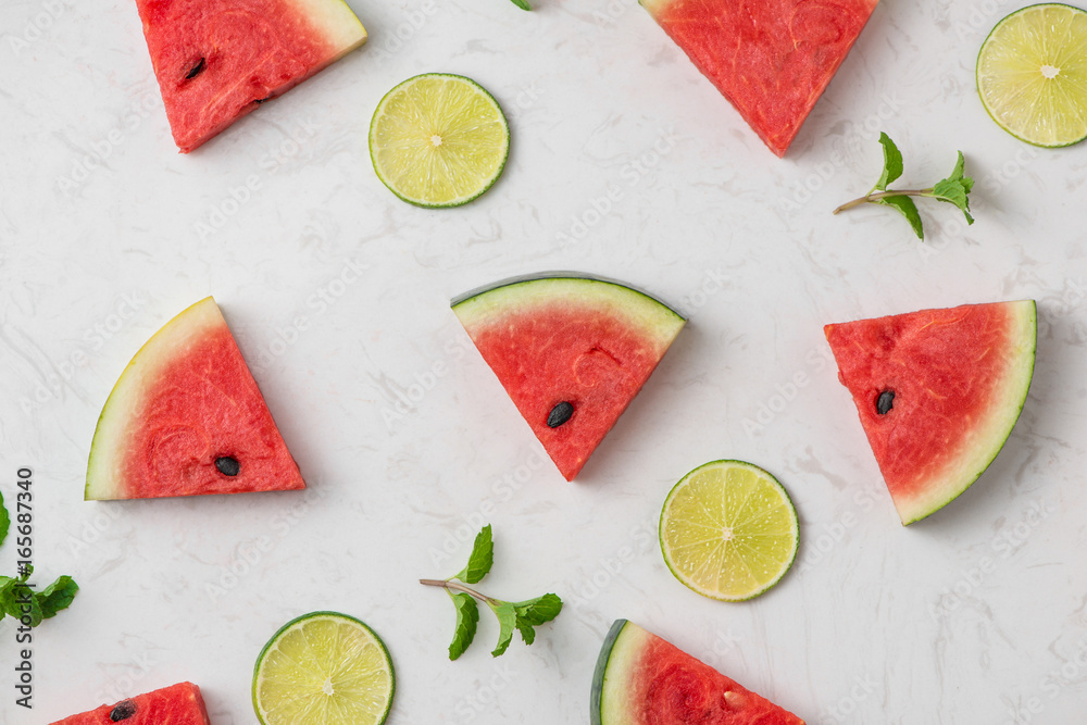 Fresh sliced watermelon on marble table in summertime