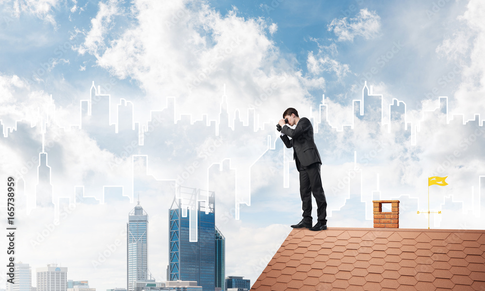 Businessman standing on roof and looking in binoculars. Mixed media