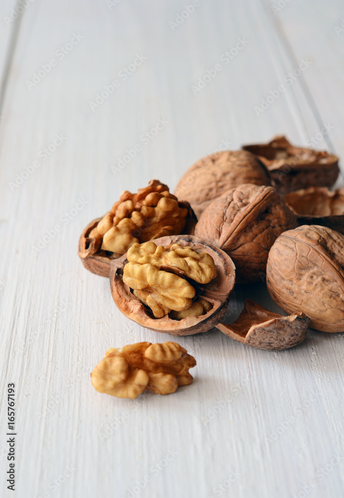 Walnuts on rustic old wooden table