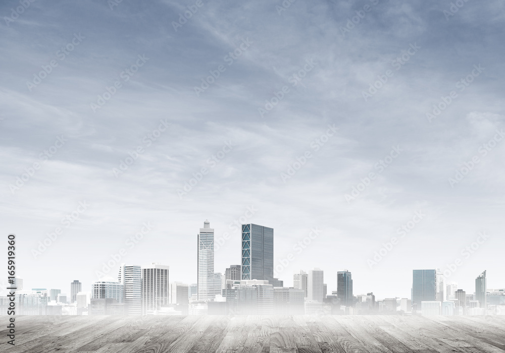 Modern urban buildings skyscrapers blue cloudy sky background and wooden textured platform