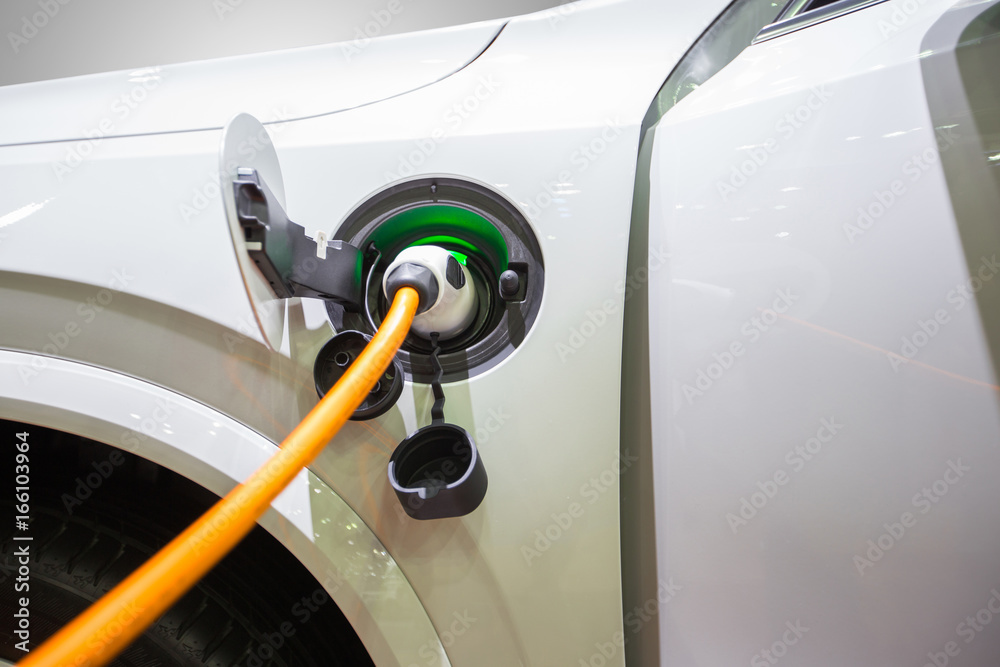 Electric hybrid car plugin in to charger to charging electric power to battery to reserve energy.