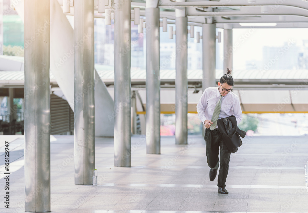 Stressed anxious businessman in a hurry and running, he is late for his business appointment and Wea