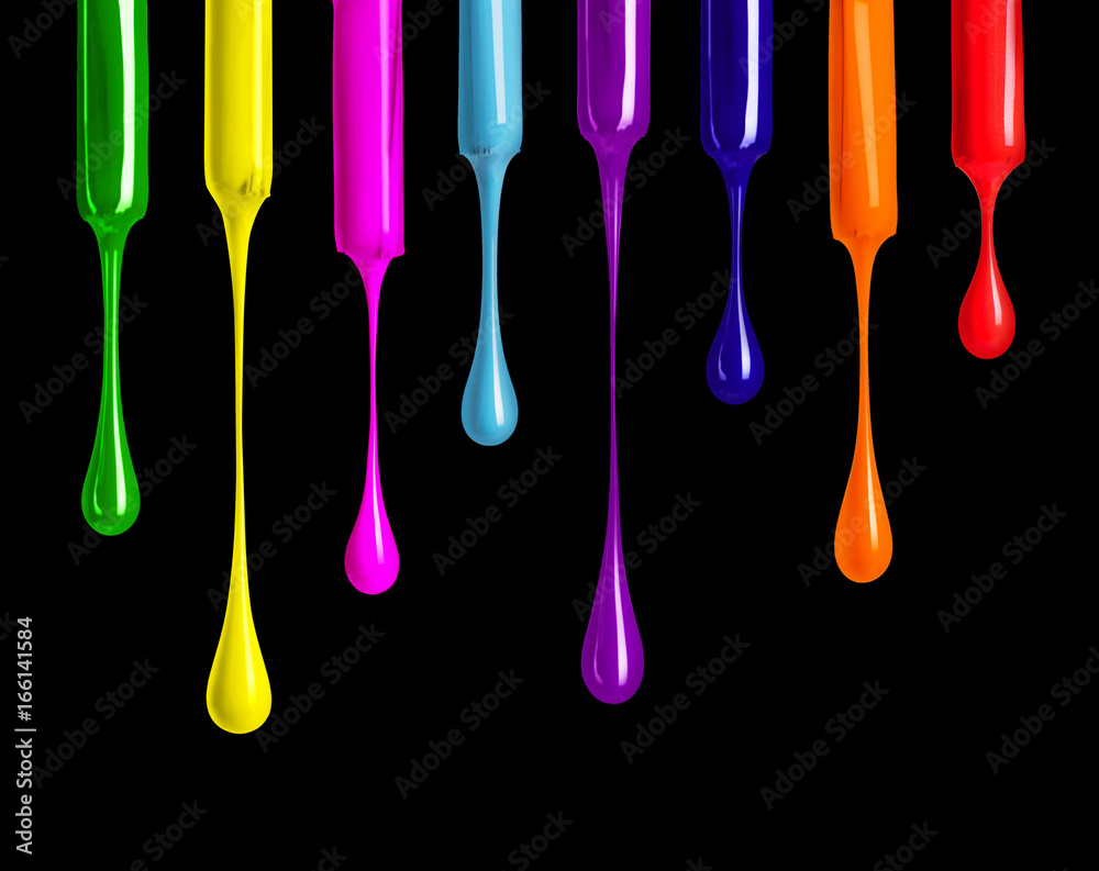 Colorful nail polishes drop on black background