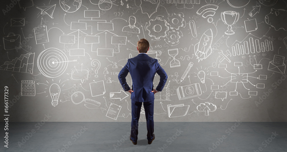 Businessman watching a project sketch on a wall 3D rendering