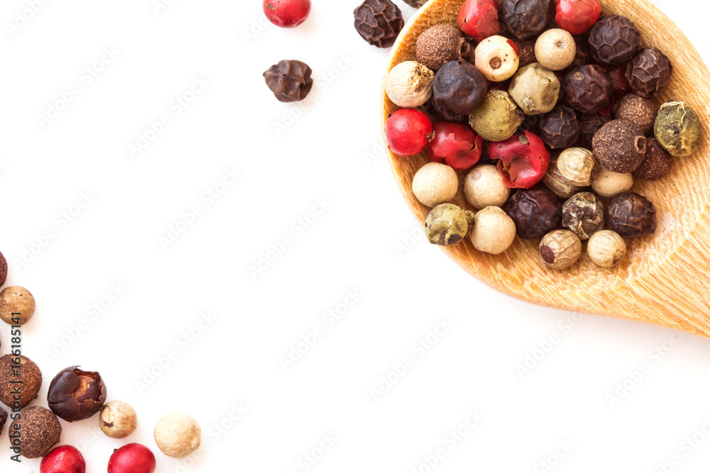 Close up mixed type of the peppercorns in wooden spoon , top view or overhead shot