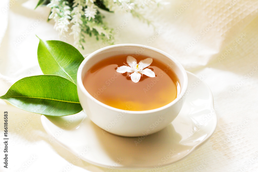 Close up organic tea in white cup with green leaf , Tea ceremony time concept