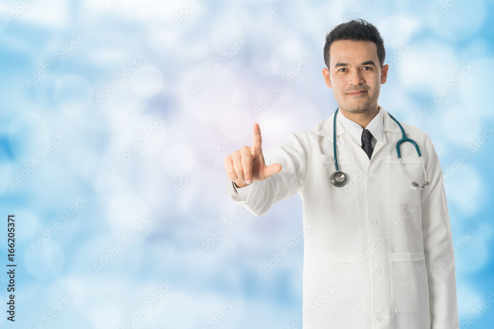 Male doctor pointing finger at copy space.