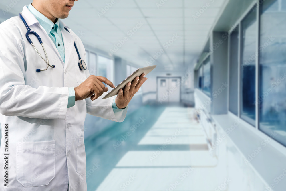 Male Doctor Working on Tablet Computer