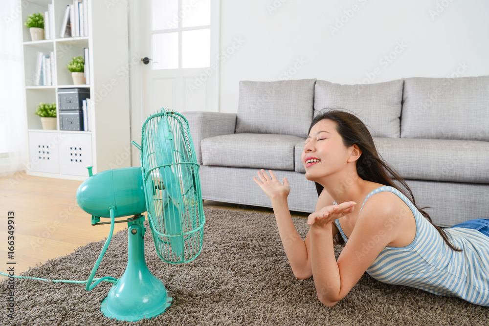 beautiful young woman enjoying cool wind