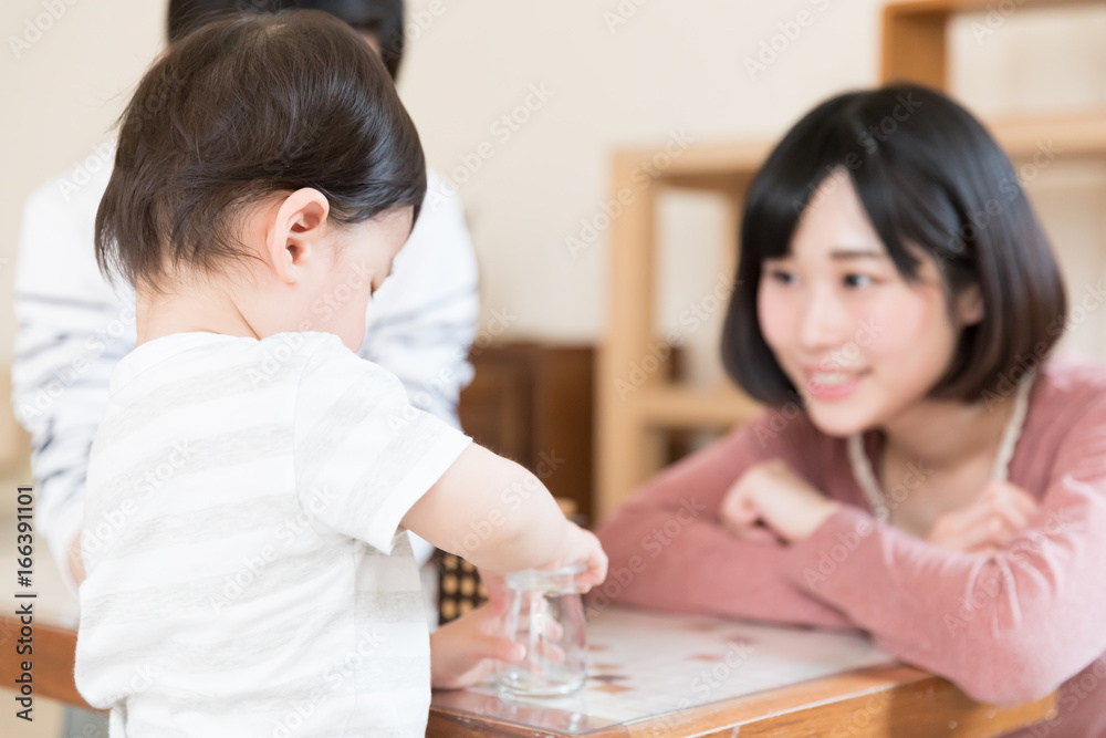 asian baby playing blocks